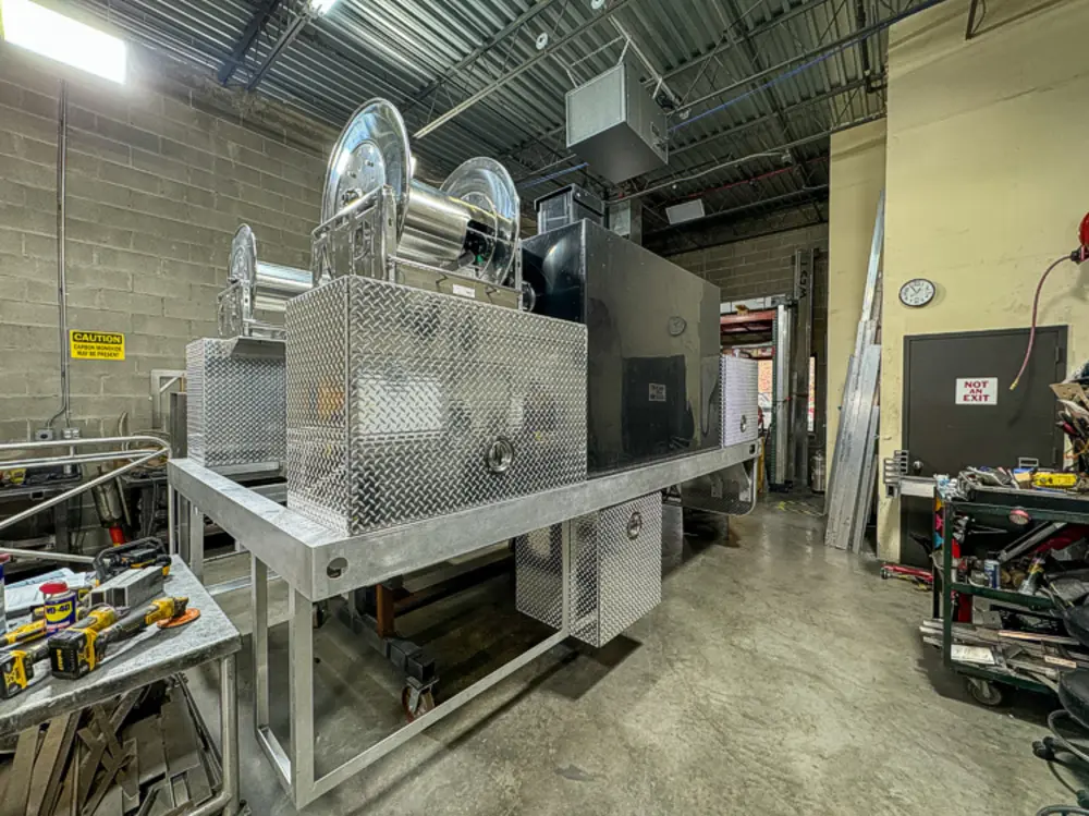 Diamond-plate body and step detail in production, photo 128 of 303.